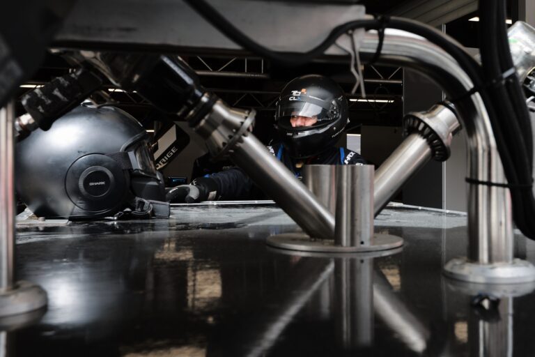 Barcelona, Spain. 11th Apr 2026. mechanic prepares in the garage, focused and ready for the session while surrounded by the fuel and mechanical components in the box. Credit: Craig Allan-McWilliams/Alamy Live News