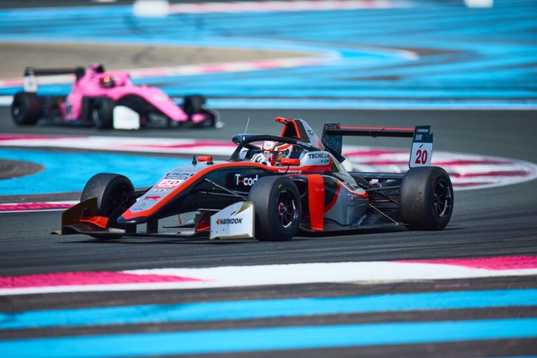 1st May 2026. #20 Tatuus F4 T-421 of Benjamin Beckley (TECNICAR) single-seater navigates a high-speed corner under pressure, with the pink challenger closing in behind on the exit.. Credit: Craig Allan-McWilliams