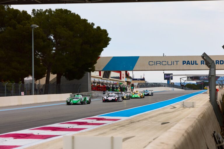 3rd May 2026. pack of endurance prototypes navigates the approach to a bridge, with the green car holding position ahead of close competitors under overcast skies. Credit: Craig Allan-McWilliams